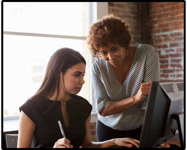 Two people by a computer